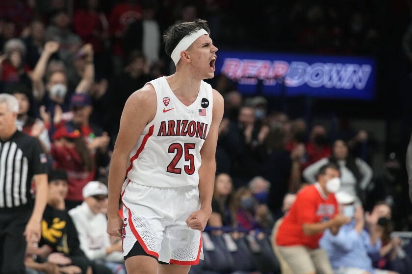 Arizona guard Kerr Kriisa reacts to the crowd during the second half of an NCAA college basketball game against Northern Colorado, Wednesday, Dec. 15, 2021, in Tucson, Ariz. Arizona won 101-76. (AP Photo/Rick Scuteri)