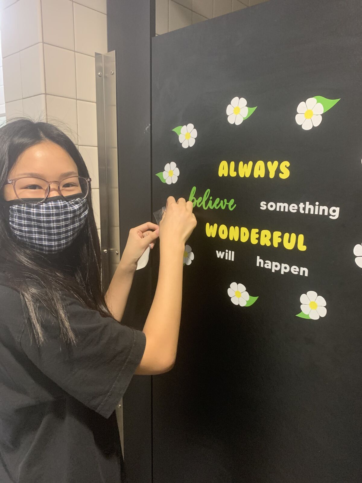 Girl Scout Vicky Xu helps put out a positive message at Solana Ranch.