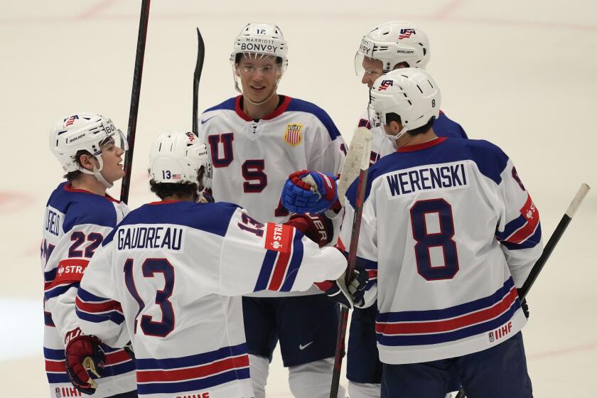 Unted States' Brady Tkachuk celebrates with teammates after scoring his side's fourth goal during the preliminary round match between United States and Kazakhstan at the Ice Hockey World Championships in Ostrava, Czech Republic, Sunday, May 19, 2024. (AP Photo/Darko Vojinovic)