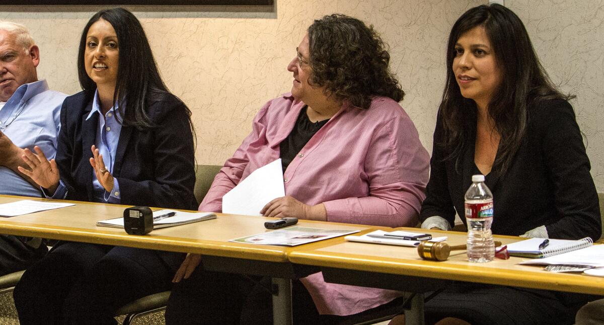 Los Angeles City Council District 6 candidates Nury Martinez, left, and Cindy Montanez, right, are shown during a forum mediated by Judy Daniels, center, at a Valley Alliance Neighborhood Councils meeting at Sherman Oaks Hospital.