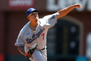 SAN FRANCISCO, CALIFORNIA - MAY 23: Julio Urias #7 of the Los Angeles Dodgers pitches in the bottom.
