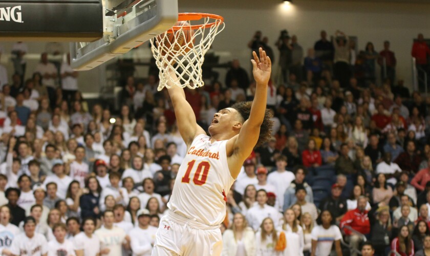 Cathedral Catholic's Beon Riley soars to the bucket.