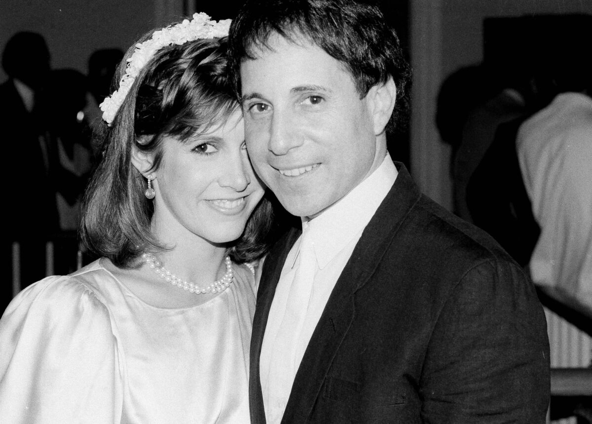 Carrie Fisher, then 26, and Paul Simon, 41, in 1983 after being wed in a private ceremony.