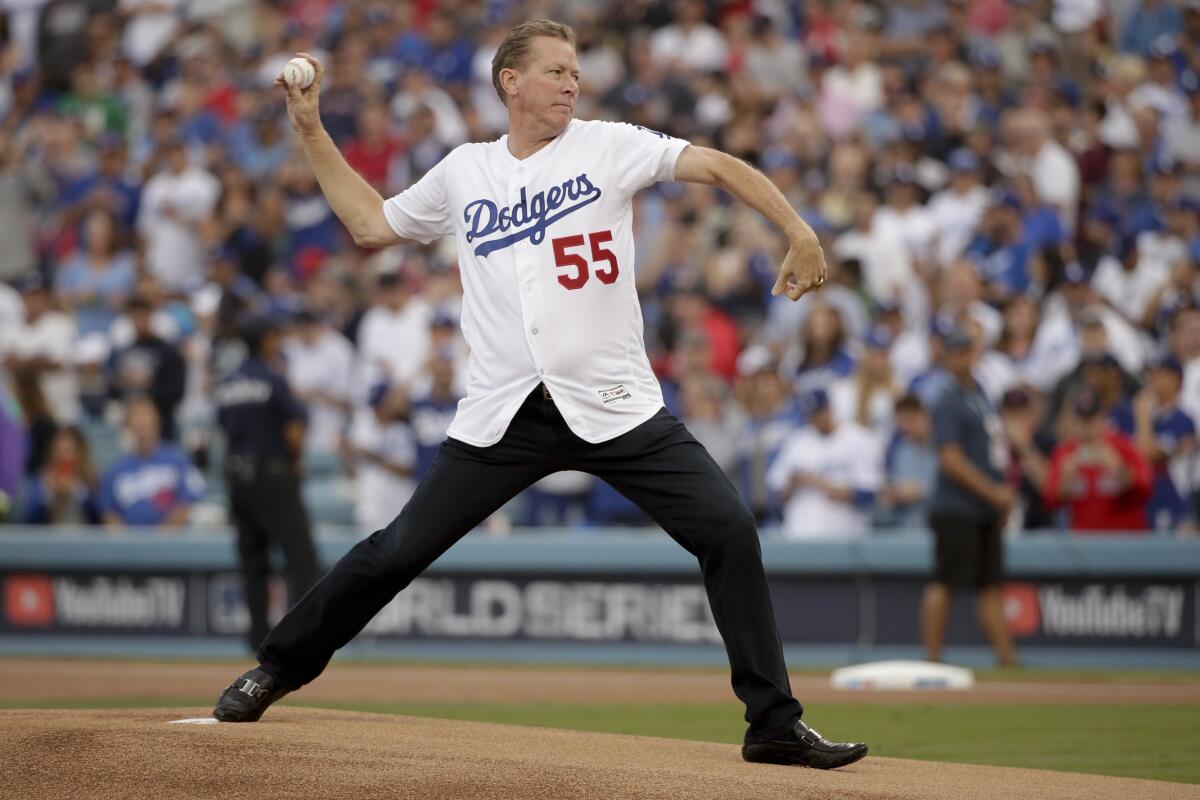 Former Dodgers pitcher Orel Hershiser throws out the first pitch before Game 5 of the 2018 World Series.