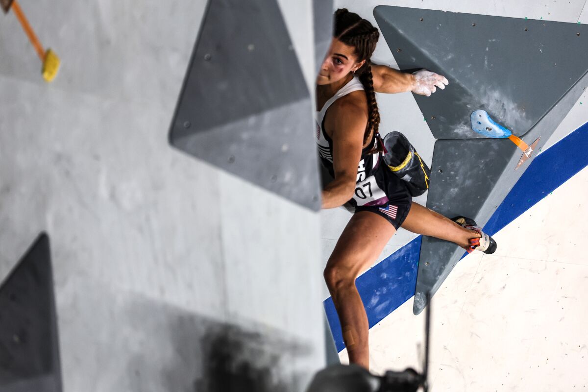 U.S. climber Brooke Raboutou struggles to make a transition during the bouldering portion of the women's sport climbing final