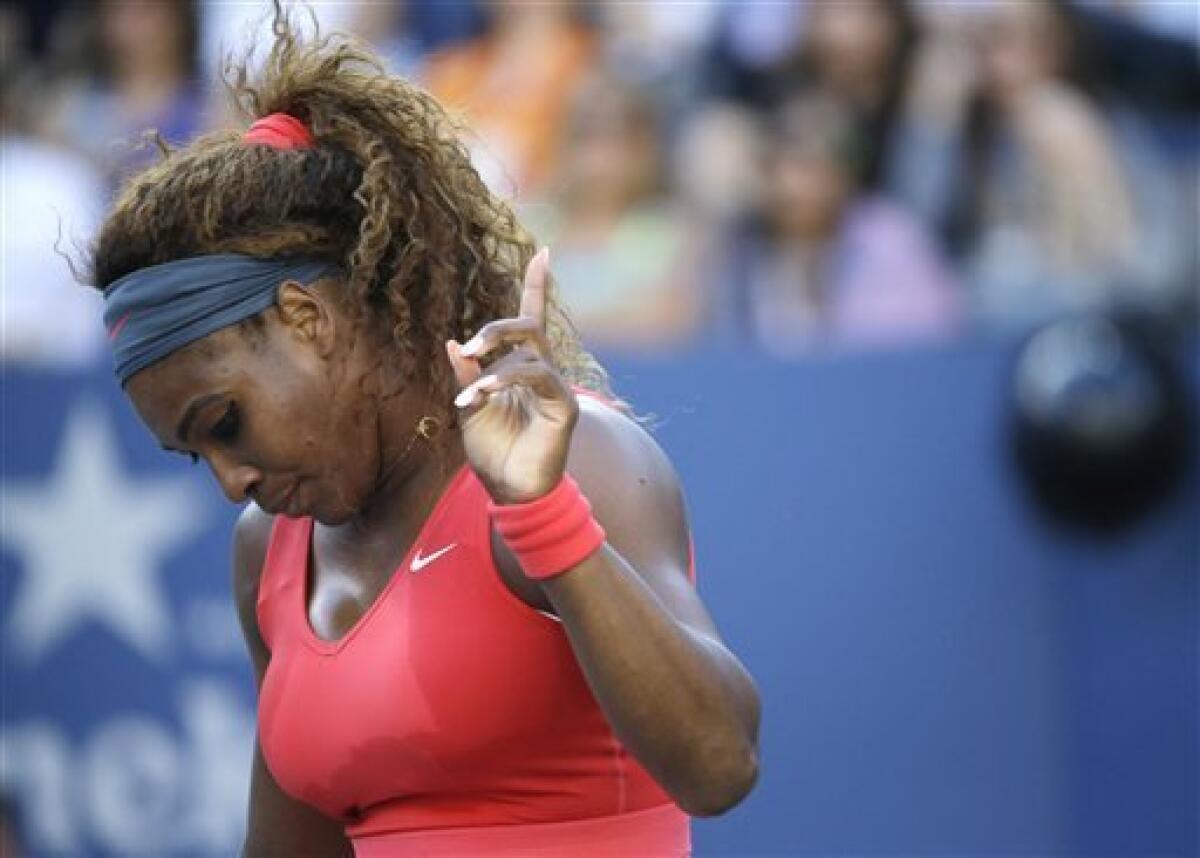 Serena Williams throws her racket after losing the second set tiebreak to  Victoria Azarenka of Belarus in the Woman's Final in Arthur Ashe Stadium at  the U.S. Open Tennis Championships at the