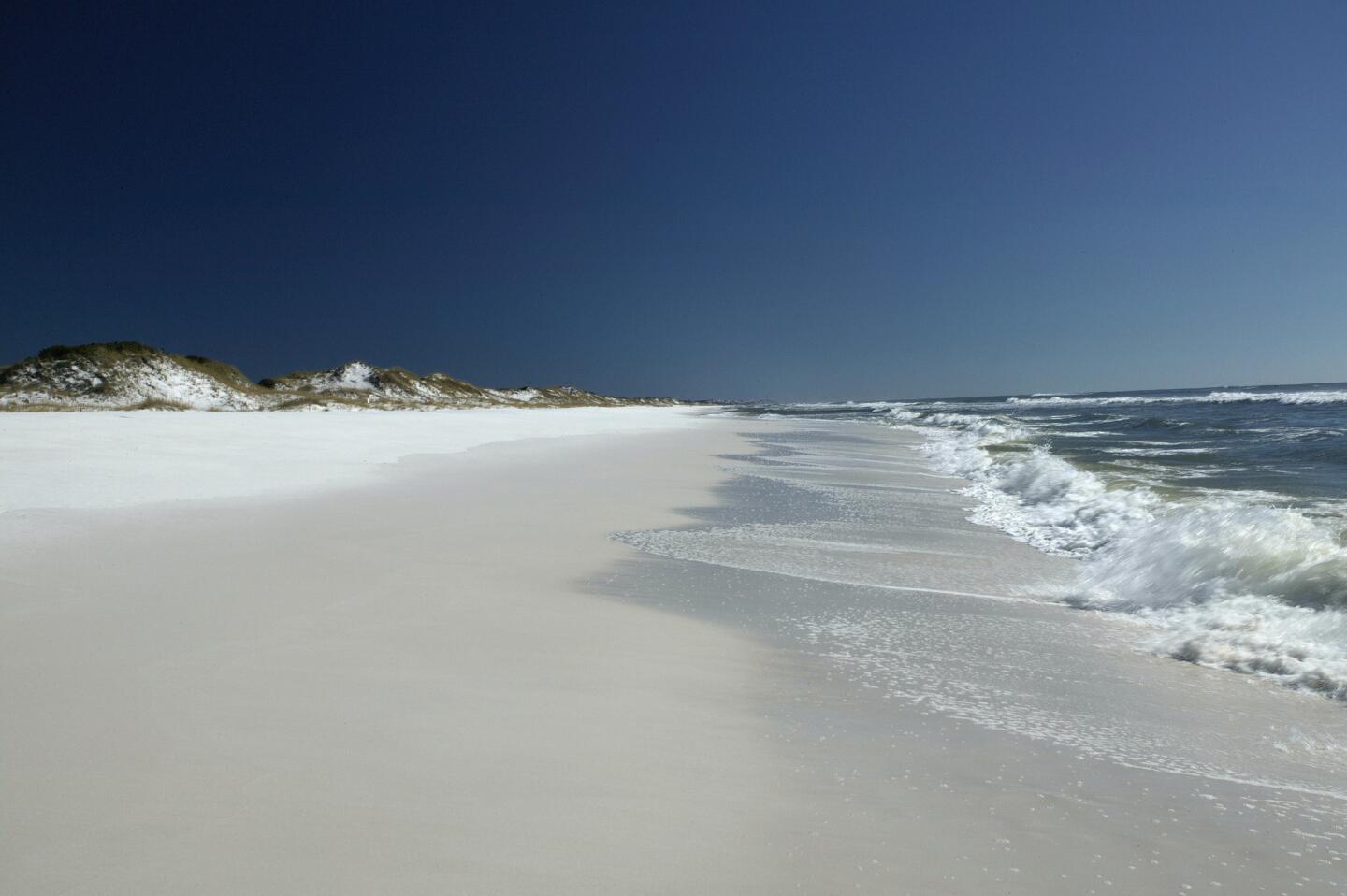 This undated photo provided by Visit South Walton shows Grayton Beach on Florida's Panhandle on the Gulf Coast. Grayton Beach State Park is No. 3 on the list of top beaches for the summer of 2018 as compiled by Stephen Leatherman, also known as Dr. Beach, a professor at Florida International University. The beach was named No. 1 in the U.S. in Dr. Beach's 1994 best beach list.