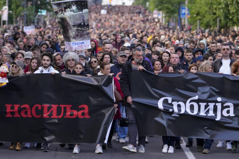 People march during a rally against violence in Belgrade, Serbia, Friday, May 12, 2023. Serbia’s populist leader has sharply denounced opposition plans to block a key bridge and highway in Belgrade on Friday to press their demands in the wake of last week’s mass shootings in the Balkan country that left 17 people dead, including many children. (AP Photo/Darko Vojinovic)