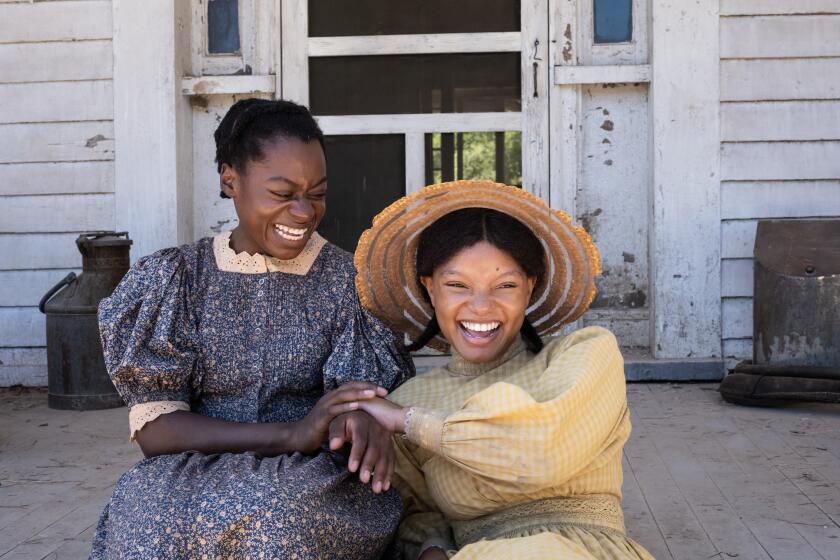 Phylicia Pearl Mpasi as Young Celie and Halle Bailey as Young Nettie in the new movie "The Color Purple."