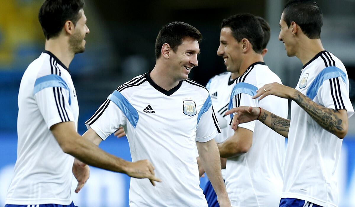 Argentina star forward Lionel Messi, second from left, chats with teammates during a training session at Maracana Stadium in Rio de Janeiro on Saturday.