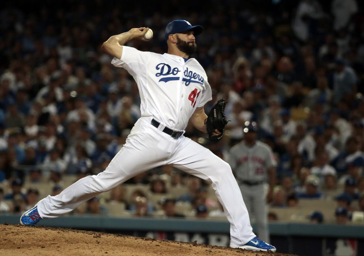 Dodgers reliever Chris Hatcher, shown throwing a scoreless eighth inning against the Mets in Game 5 of the NLDS on Oct. 15, epitomized the bullpen this season: stellar at times and shaky at others.