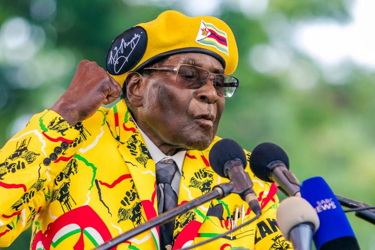 Then-President Robert Mugabe addresses the media after voting at a polling station in Zimbabwe's runoff presidential election in 2017.