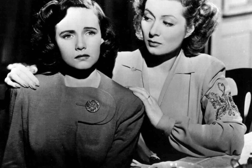 In this handout photo from 1942, Teresa Wright, left, and Greer Garson are shown in character in a scene from the movie, "Mrs. Miniver." Wright, the willowy actress who starred opposite Gary Cooper and Marlon Brando and won a supporting Academy Award in 1942 for "Mrs. Miniver," has died. She was 86. (AP Photo)