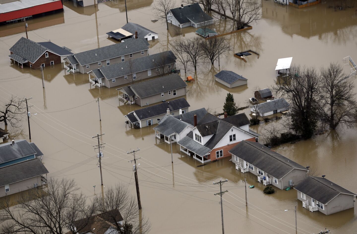 Homes are surrounded by floodwater in Pacific, Mo.