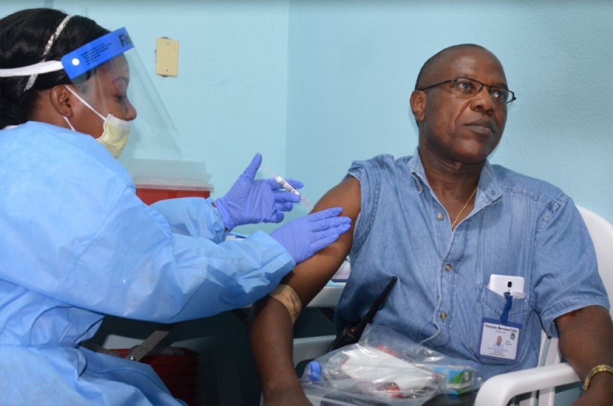 Dr. Francis Kateh receives an experimental Ebola vaccine as part of a clinical trial that began in Liberia in February 2015. With the number of new cases falling, some experts say it may be too late to gather useful scientific data about potential Ebola drugs and vaccines.