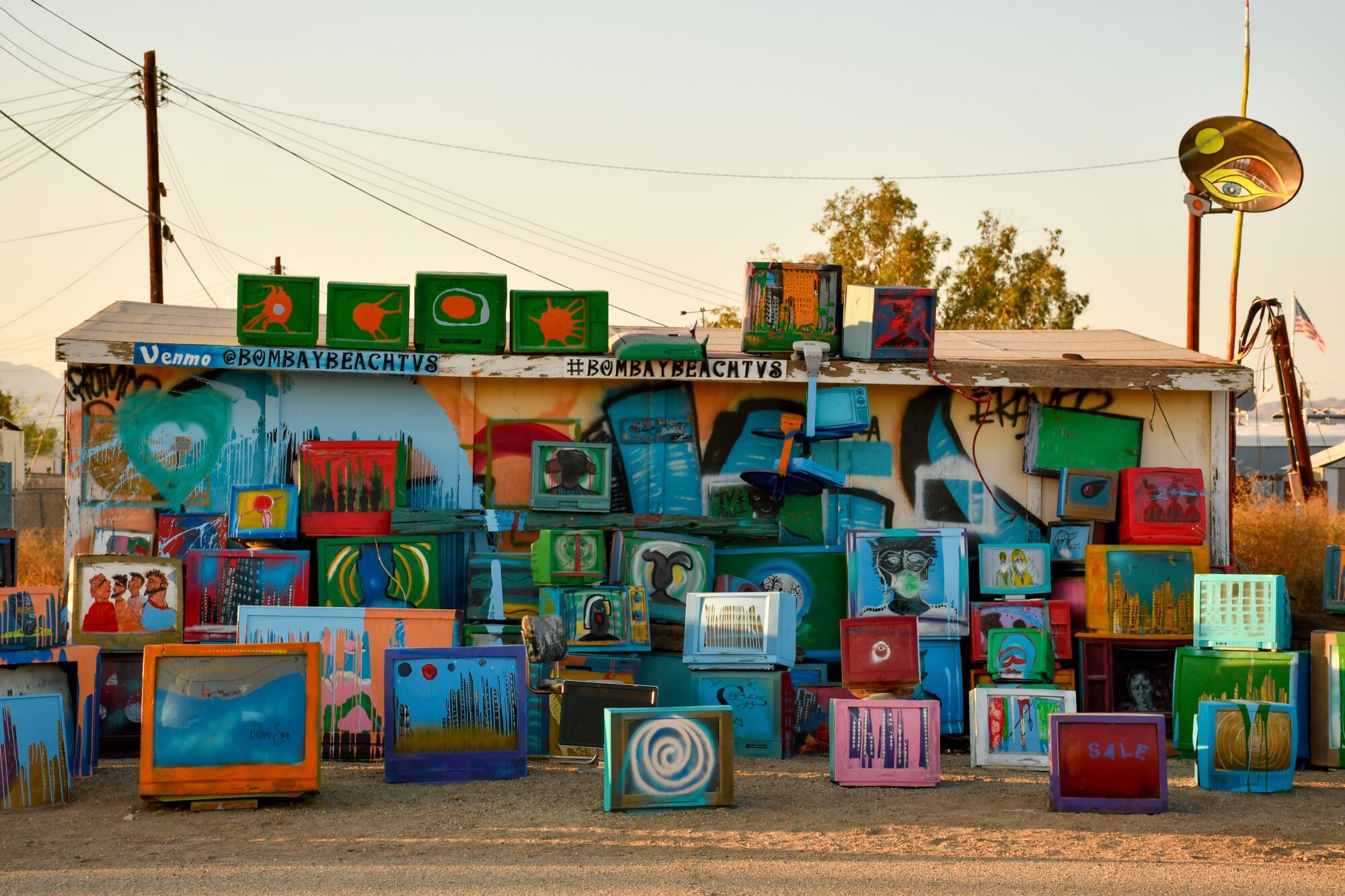 A variety of painted televisions in Bombay Beach.