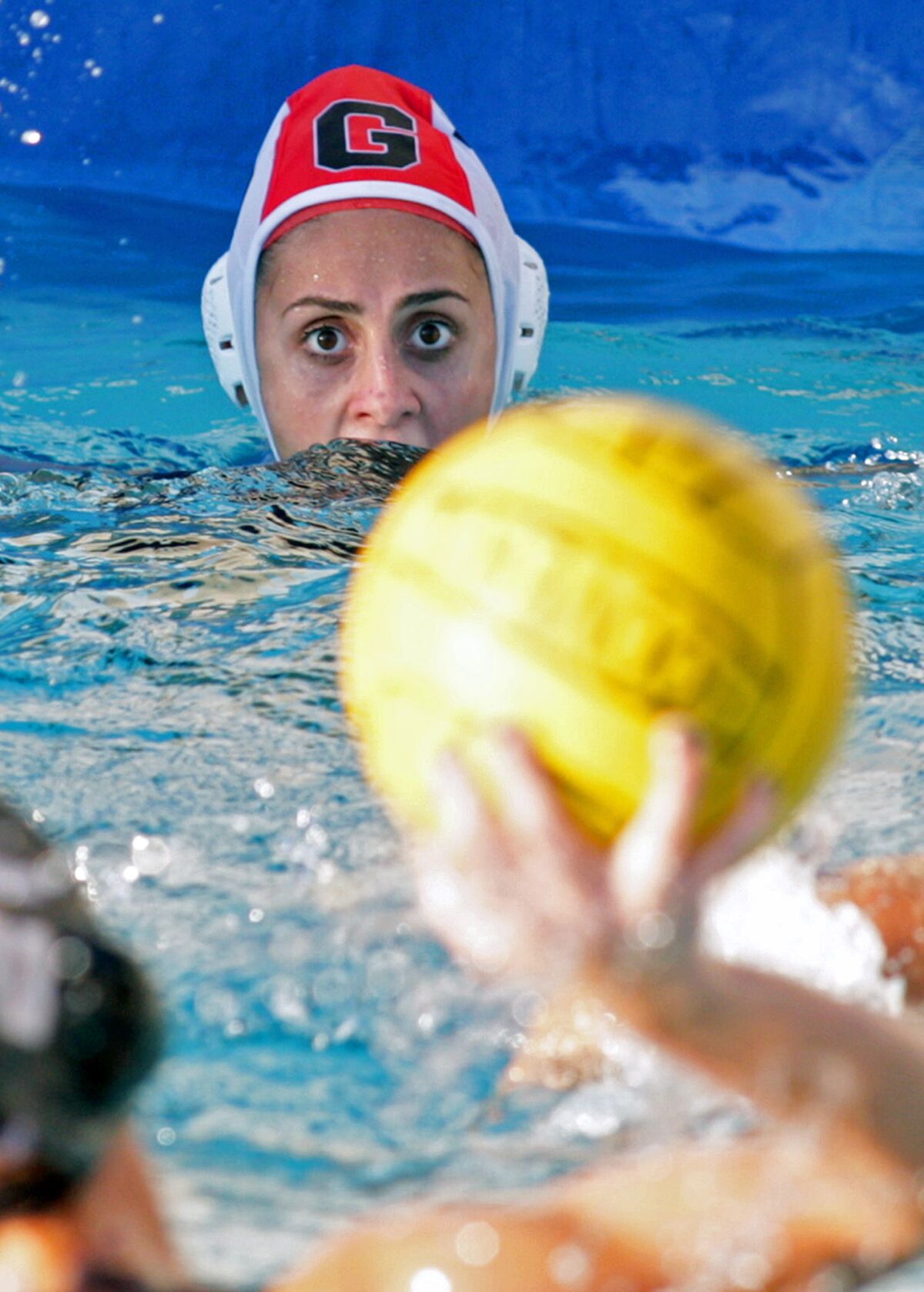 Glendale High girls' water polo goalie Shushanik Gabrielyan prepares to block a shot in a game against Hoover High. Gabrielyan, who graduated in 2015, has filed a lawsuit against the Glendale Unified School District, claiming that water polo practices were "extremely intense and egregiously inappropriate."