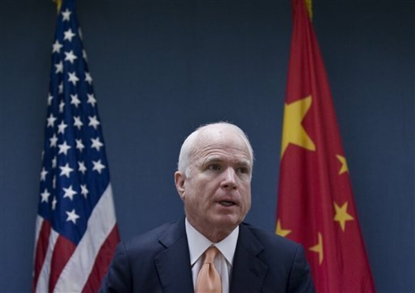 U.S. Senator John McCain speaks during a news conference held at the U.S. Embassy in Beijing, China, Thursday, April 9, 2009. John McCain is urging China to take a harder stand against North Korea following Pyongyang's latest missile launch. (AP Photo/Andy Wong)