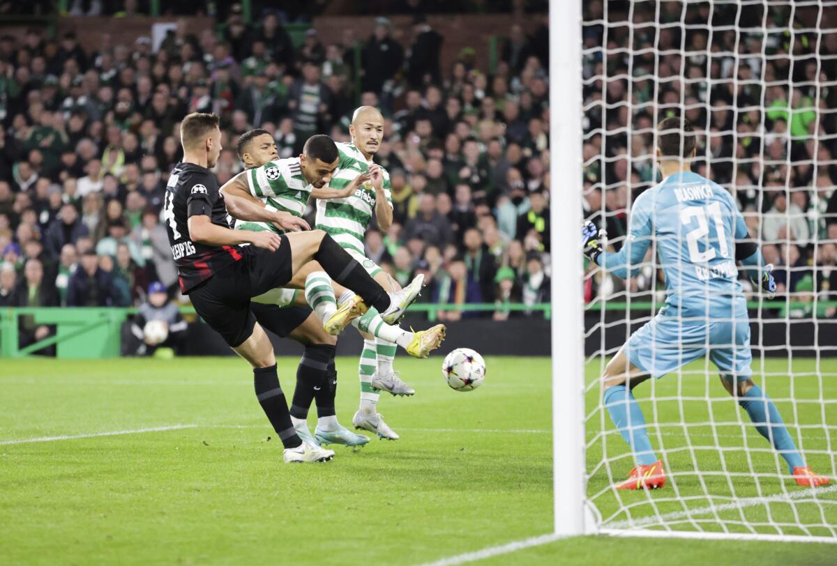 Celtic's Giorgos Giakoumakis takes a shot during the Group F Champions League soccer match between RB Leipzig and Celtic at the Celtic Park stadium in Glasgow, Scotland, Tuesday, Oct. 11, 2022. (Steve Welsh/PA via AP)