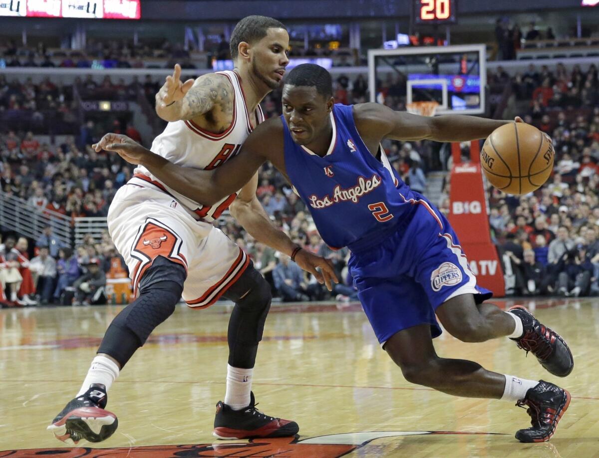 Darren Collison drives against Chicago's D.J. Augustin during the first half of the Clippers' 112-95 win Friday over the Bulls. Collison had 17 points with four assists.