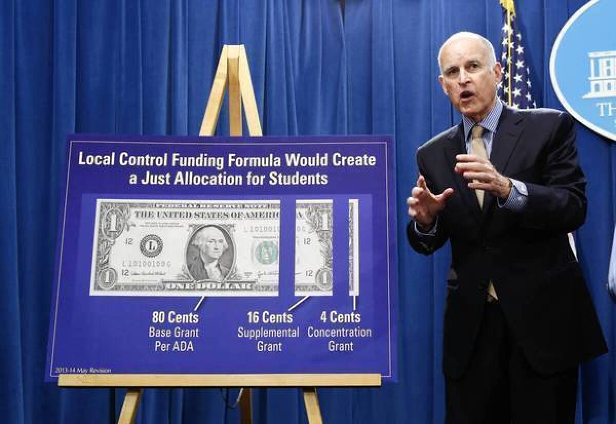 Gov. Jerry Brown answers a question about his education funding plan at a news conference in Sacramento.