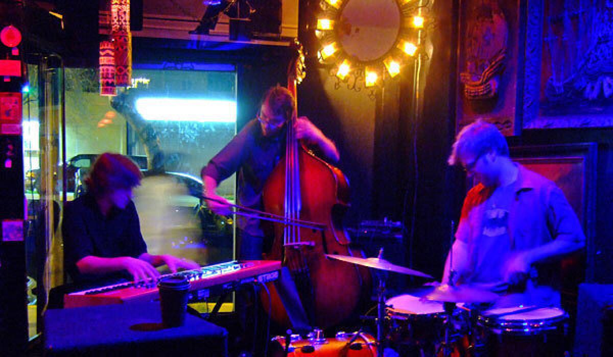 The late Austin Peralta, left, performing with his trio at Lot 1 Cafe in April 2011.