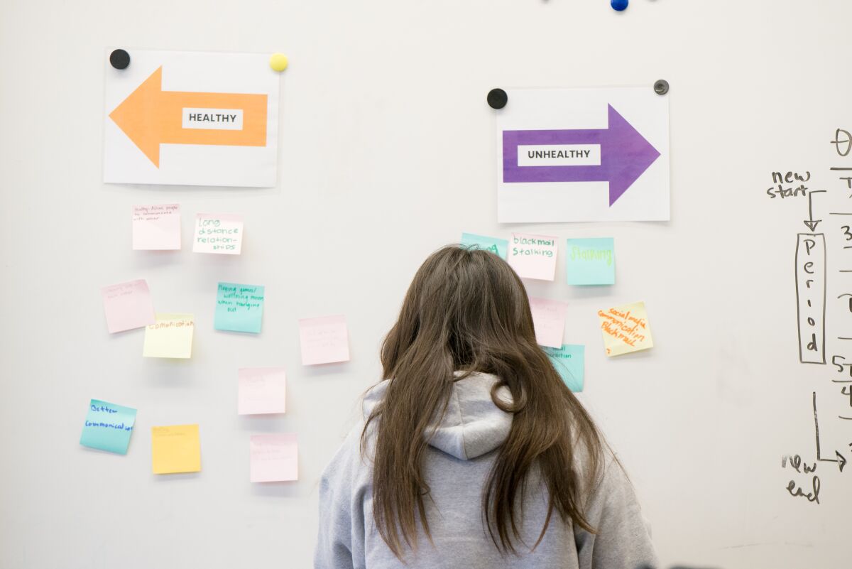 A woman participates in a Human Options' workshop.