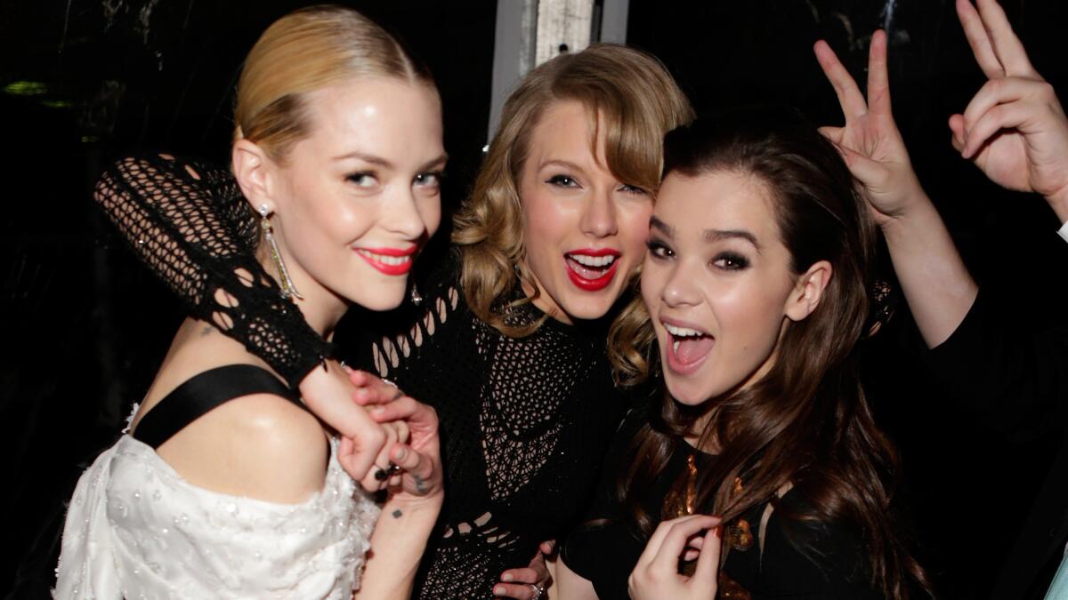 Taylor Swift, center, with two of her besties, Jaime King, left, and Hailee Steinfeld. The friends can celebrate now that "bestie" has been added to the dictionary.