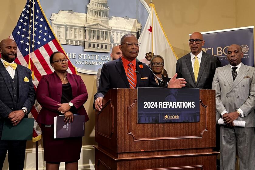 Assemblymember Reggie Jones-Sawyer, D-Los Angeles, speaks about a package of reparations legislation at a press conference at the state Capitol on Wednesday, Feb. 21, 2024. (AP Photo/Sophie Austin)