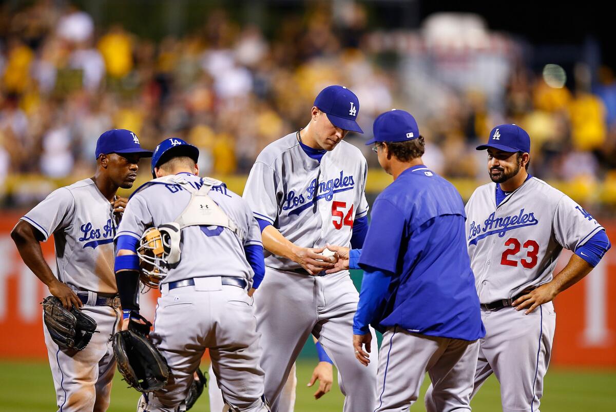 Dodgers Manager Don Mattingly replaces reliever Jim Johnson in the seventh inning, when the Pirates scored nine runs.