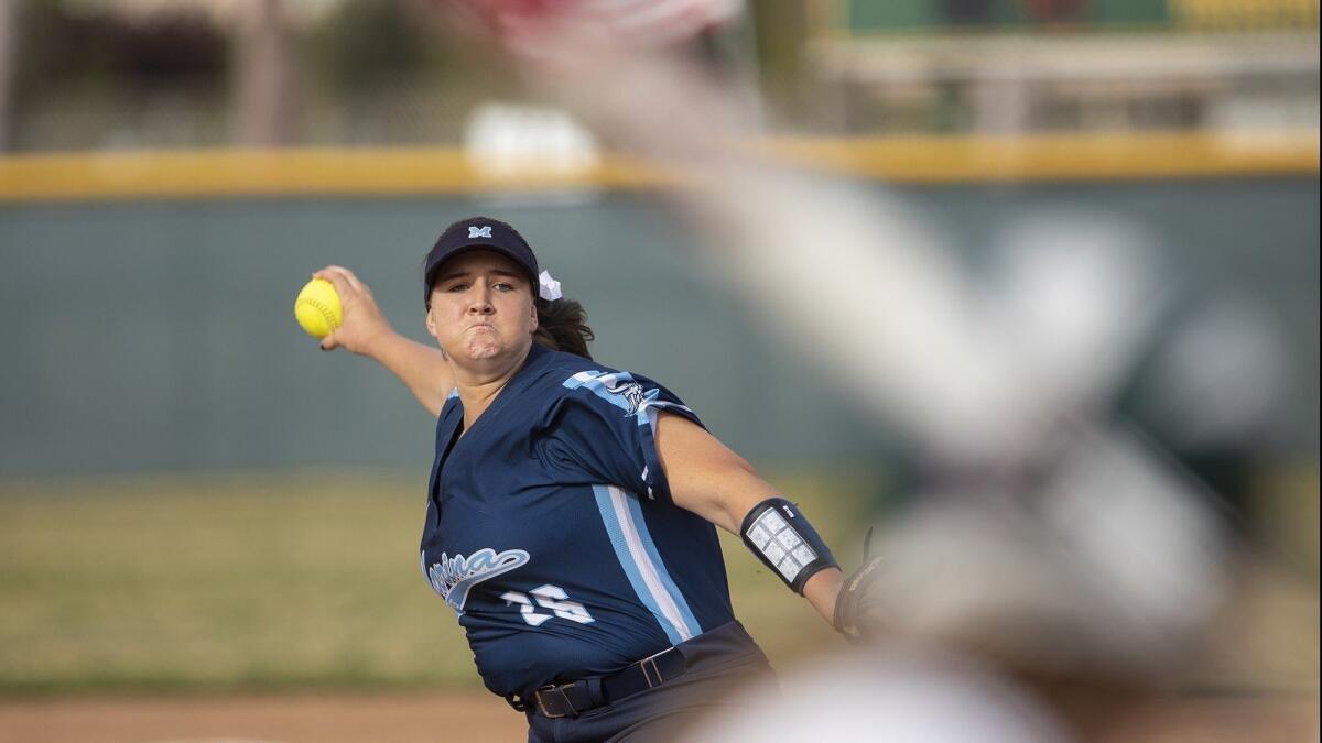 Marina's Emily Rush pitches during a Surf League game against Edison on April 11, 2019.