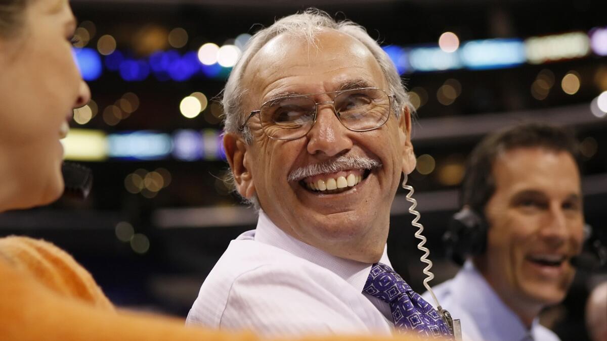 Clippers play-by-play announcer Ralph Lawler calls a game at Staples Center in 2009.