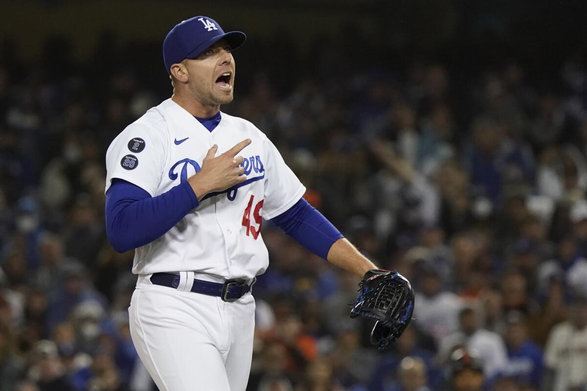 Dodgers relief pitcher Blake Treinen reacts after striking out San Francisco's Donovan Solano in Game 3.