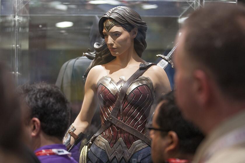 Fans take in the new Wonder Woman costume July 8 at Comic-Con in San Diego.