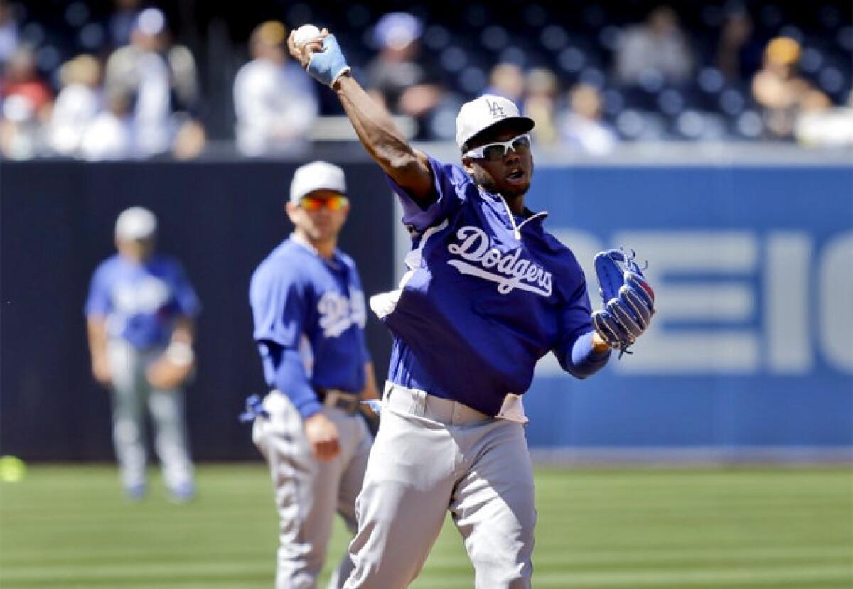 Dodgers shortstop Hanley Ramirez throws during warm-ups before a game against the San Diego Padres.