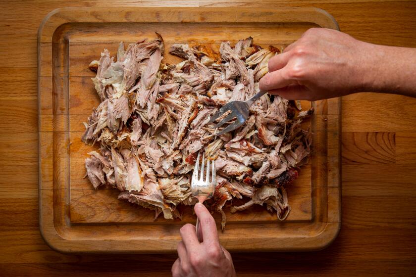 LOS ANGELES, CA - AUGUST 28: Fool-proof pulled pork, pulled by forks, but not before roasting the pork in the oven at high heat to brown/caramelize the outside, for 30-60 minutes, then reduce heat to 250 and cook until internal temp is 200 degrees, 10 to 14 hours, depending on size and weight of the cut, remove from oven, let rest until cool enough to touch with hands for serving, photographed at a Los Angeles, CA, home, Friday, Aug. 28, 2020. (Jay L. Clendenin / Los Angeles Times)