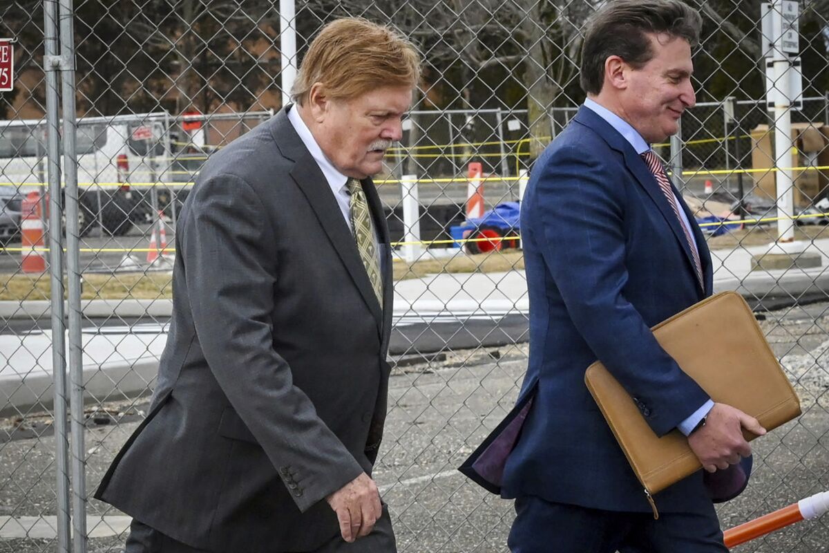 FILE - Robert Fehring, left, arrives at federal court with his attorney in Central Islip, NY, Wednesday, Feb. 23, 2022. Fehring has been sentenced to 30 months in prison for mailing dozens of violent threats to LGBTQ affiliated individuals, groups and businesses over several years, Wednesday, Aug. 3, 2022. (James Carbone/Newsday via AP, File)
