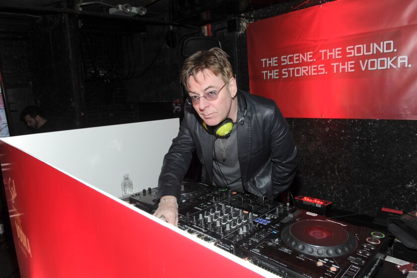 IMAGE DISTRIBUTED FOR STOLI VODKA - The Smith's Andy Rourke, Rock and Roll Hall of Fame nominee, DJs as a part of The Scene By Stoli Project celebrating 35 years of nightlife at The Pyramid Club on Avenue A in New York, Tuesday, Oct. 28, 2014. (Photo by Diane Bondareff/Invision for Stoli Vodka/AP Images)