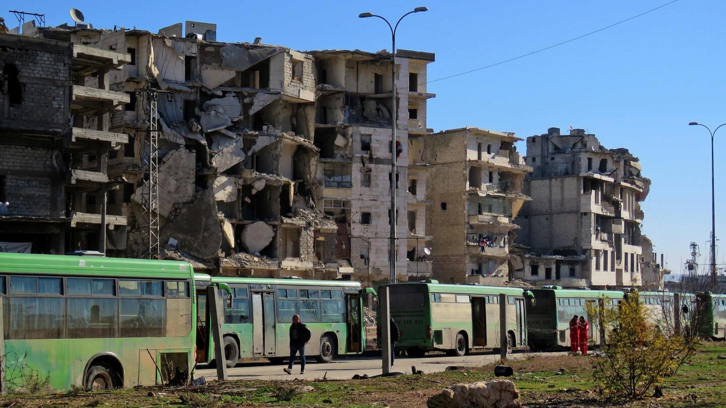 Buses wait in Aleppo