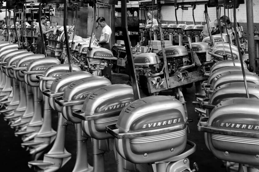 Constructing Outboard Motors at the Evinrude Plant (Photo by Jerry Cooke/Corbis via Getty Images)