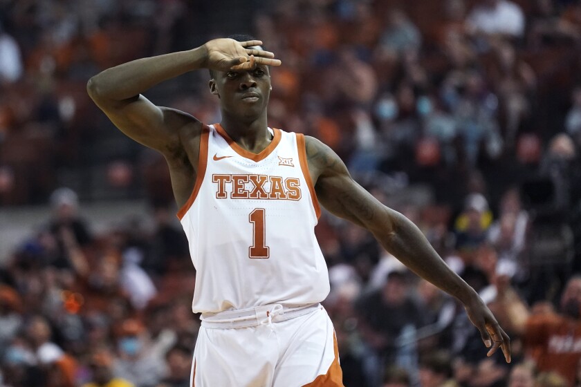 Texas guard Andrew Jones (1) celebrates after making a 3-point basket during the second half of an NCAA college basketball game against West Virginia, Saturday, Jan. 1, 2022, in Austin, Texas. (AP Photo/Eric Gay)