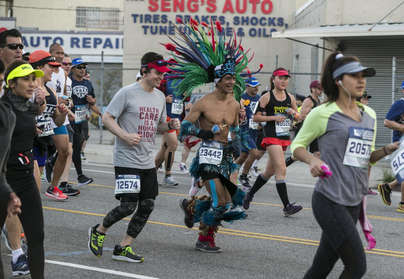 Runners run on Sunset Blvd. during the Los Angeles Marathon Sunday, March 19, 2017. (AP Photo/Damian Dovarganes)