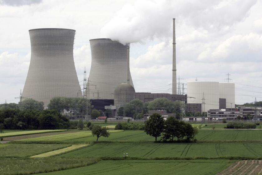 FILE - The nuclear power station is seen in Gundremmingen,southern Germany, May 23, 2006. Germany on Friday, Dec. 31, 2021 is shutting down half of the six nuclear plants it still has in operation, a year before the country draws the final curtain on its decades-long use of atomic power. (AP Photo/Christof Stache, file)