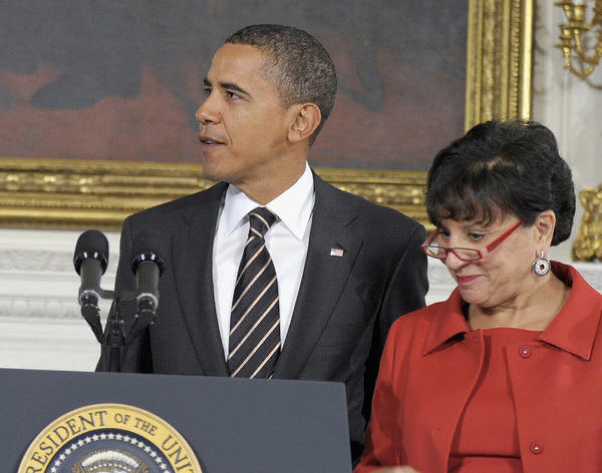 President Obama stands with Commerce Secretary nominee Penny Pritzker in the White House.