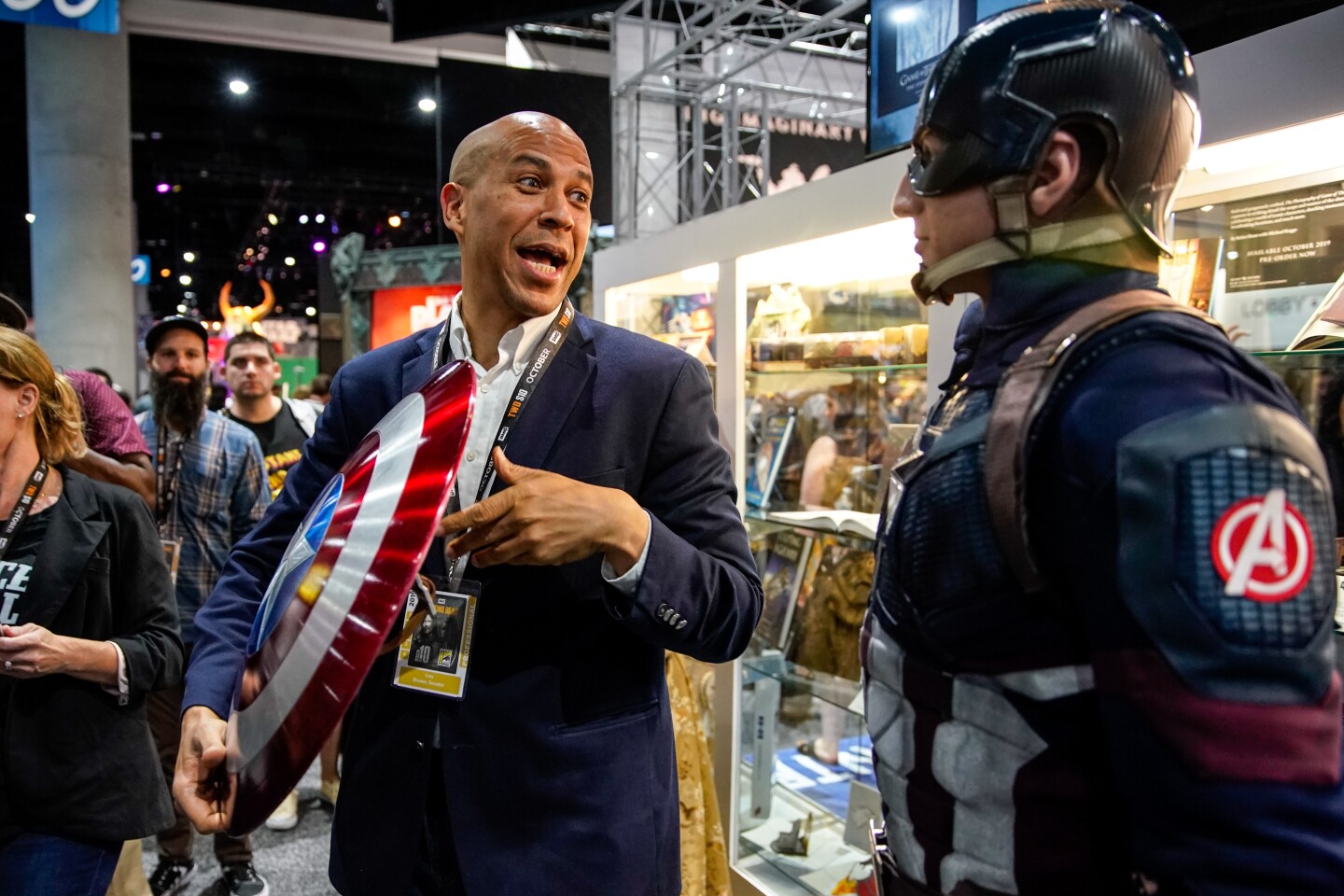 SAN DIEGO, CALIF. - JULY 19: Presidential Candidate Corey Booker talks with John Vash, cosplaying as "Captain America," while holding his shield at Comic-Con International while walking the exhibition hall at the San Diego Convention Center at on Friday, July 19, 2019 in San Diego, Calif. (Kent Nishimura / Los Angeles Times)