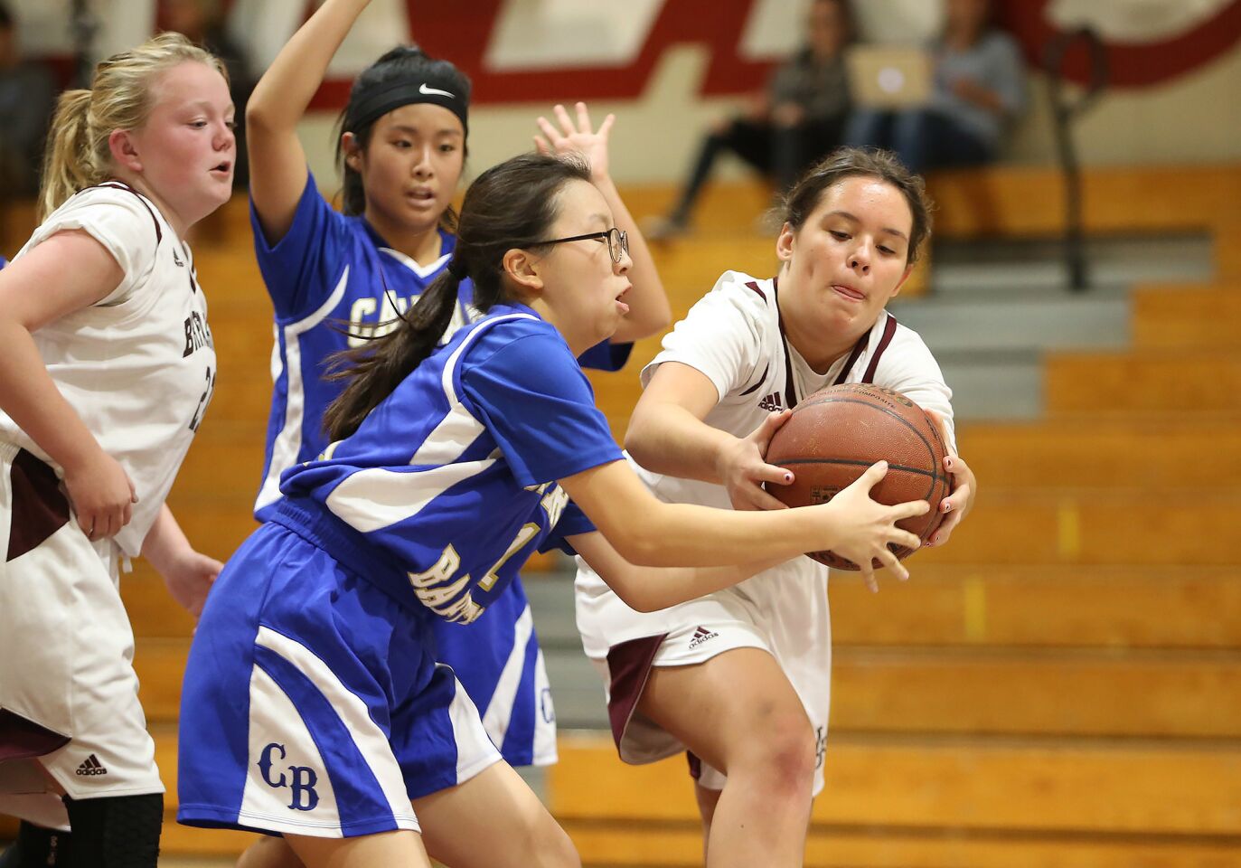Laguna's Autumn Moreland, far right, takes ball away from La Verne Calvary Baptist player for a steal during girls' basketball on Thursday.