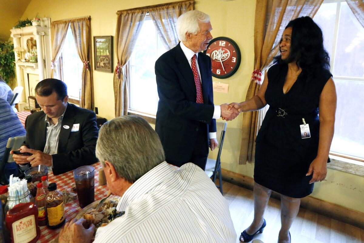 U.S. Sen. Thad Cochran (R-Miss.) greets Democratic state Rep. Deborah Butler Dixon at Mama Hamil's Restaurant in Madison.
