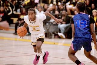 Kings/Drew guard Jayshawn Kibble drives to the basket during a CIF City Section Open Division playoff victory over Palisades.