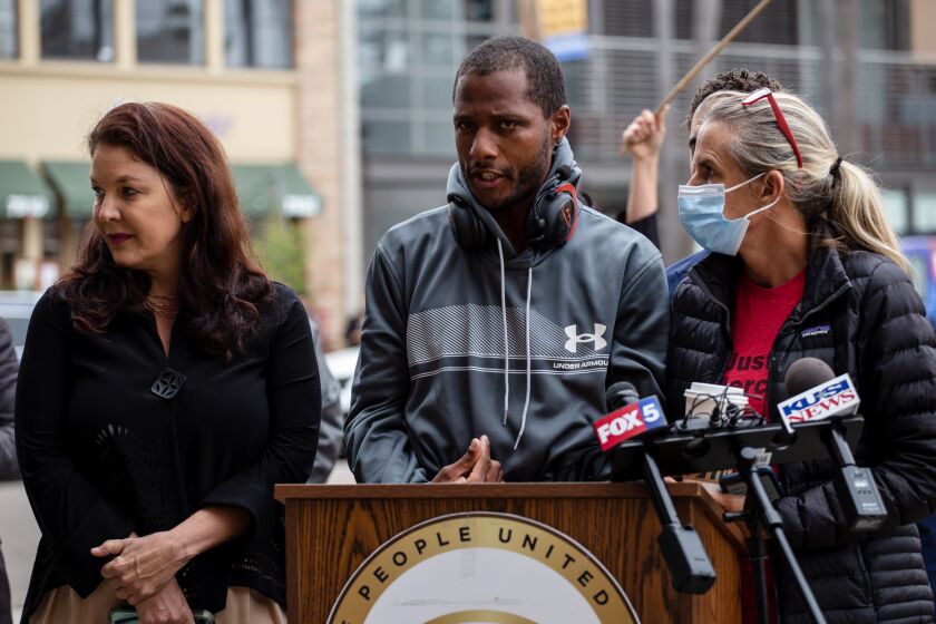 Jesse Evans, a homeless man who was punched repeatedly by police last week in La Jolla, speaks during a press conference Tuesday calling for District Attorney Summer Stephan to drop charges against him.