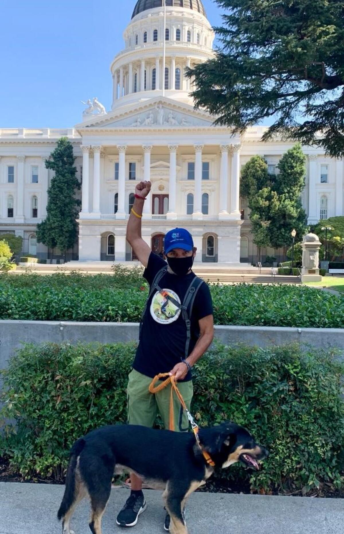Santiago Nieto in front of the Capitol in Sacramento, after a walk of 530 miles and 31 days.
